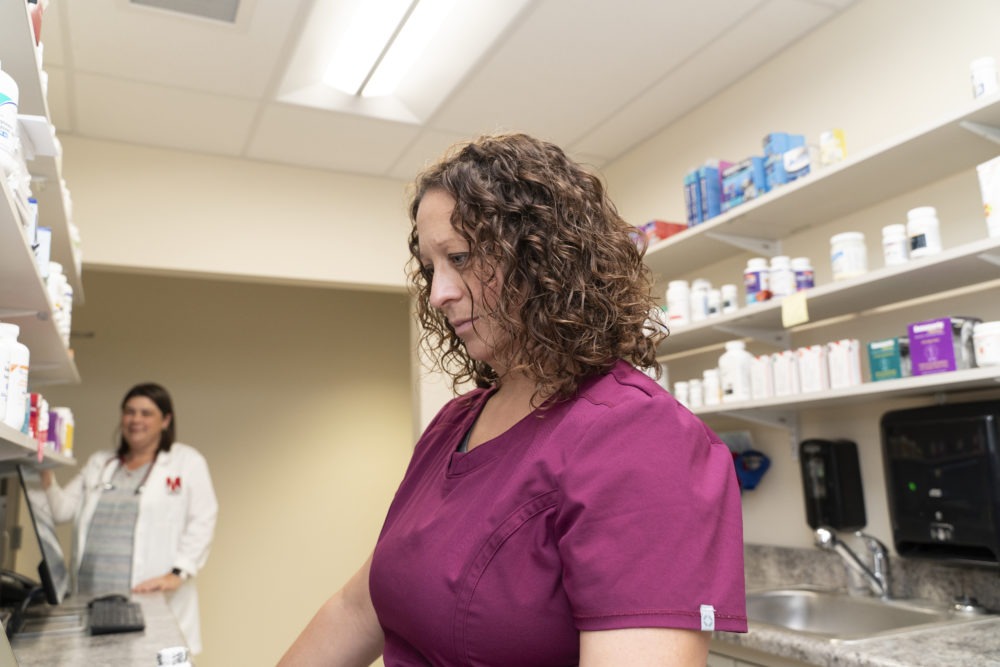 Meadowbrook Veterinary Clinic staff member working in pharmacy.